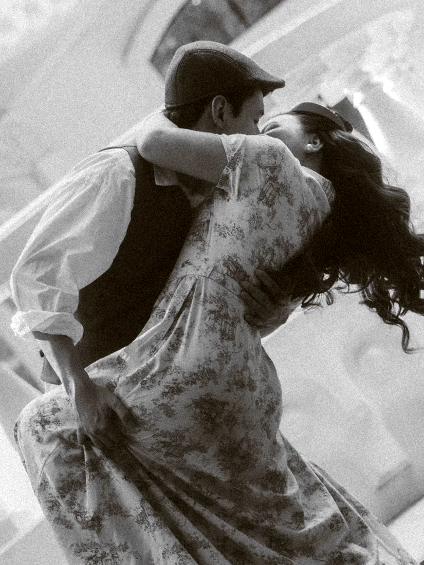 James dipping Elaine into a kiss, in black and white